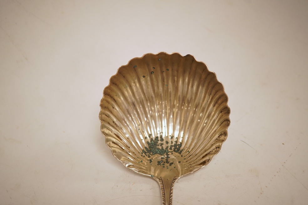 A late George II silver feather edge Old English pattern soup ladle, with fluted bowl, by Richard Rugg, London, 1759, 34cm, 5oz.